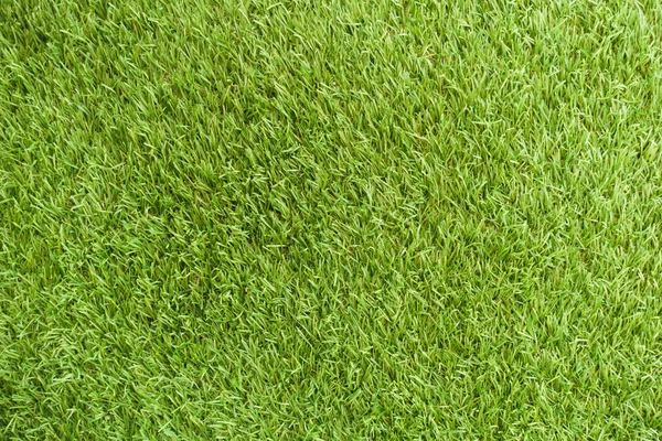 Naturrasen Textur gemusterten Hintergrund in Golfplatz Rasen von oben: abstrakte Hintergrund der authentischen Rasen Umwelt strukturierte Muster Hintergrund in hellen gelb grünen Farbton — Stockfoto
