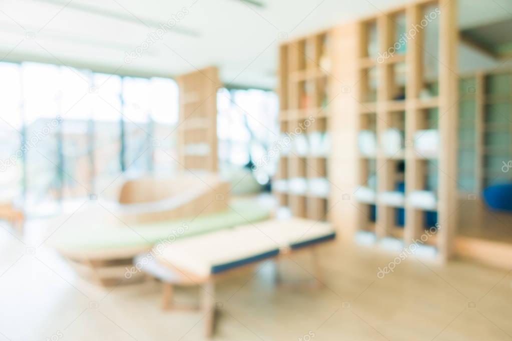 School classroom in blur background without young student; Blurry view of elementary class room no kid or teacher with chairs and tables in campus. Vintage effect style pictures.