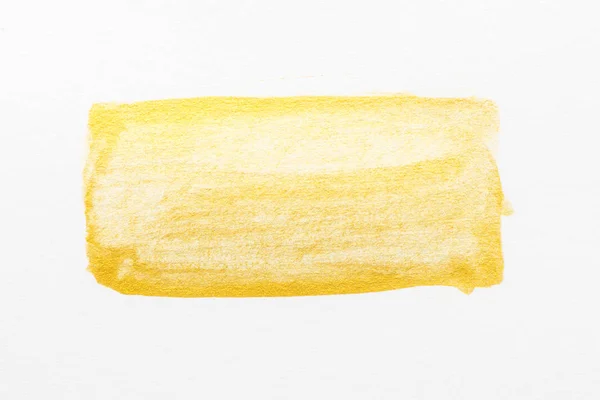 Aquarelle abstraite jaune texturée sur fond de papier blanc — Photo