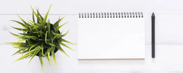 Minimal work space - Creative flat lay photo of workspace desk. White office desk wooden table background with open mock up notebooks and pens and plant. Top view with copy space, flat lay photography