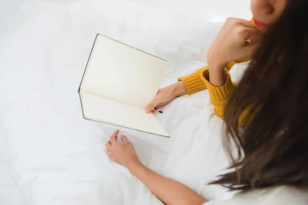 Beautiful young asian women LGBT lesbian happy couple sitting on bed reading book together near window in bedroom at home. LGBT lesbian couple together indoors concept. Spending nice time at home. — Stock Photo, Image