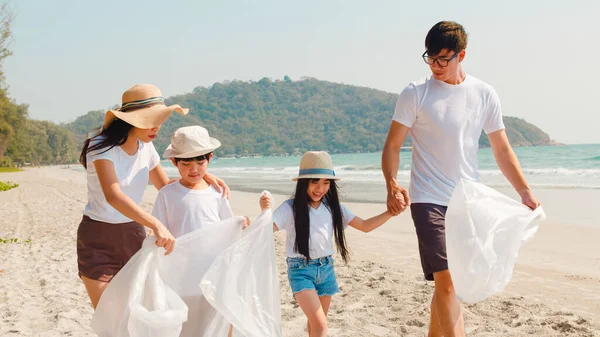 Asian Young Happy Family Activists Collecting Plastic Waste Walking Beach Royalty Free Stock Images