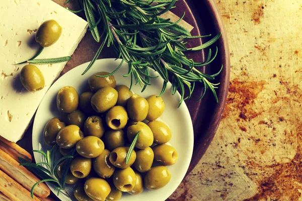 Fresh tasty greek green olives with cheese feta or goat cheese. — Stock Photo, Image