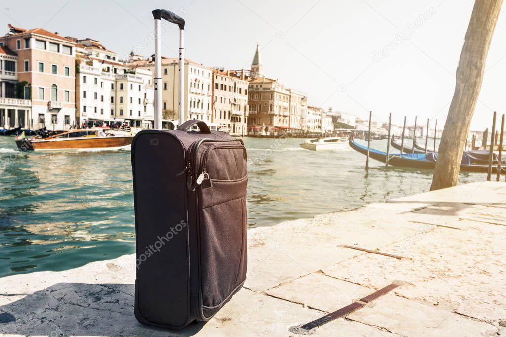 Small Suitcase on Travel Urban Background, Venice, Italy. 