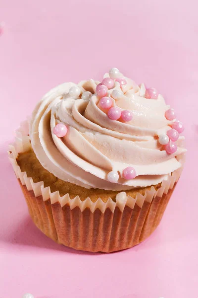 Closeup of tasty cupcakes with cream and small pearls. Pink — Stock Photo, Image