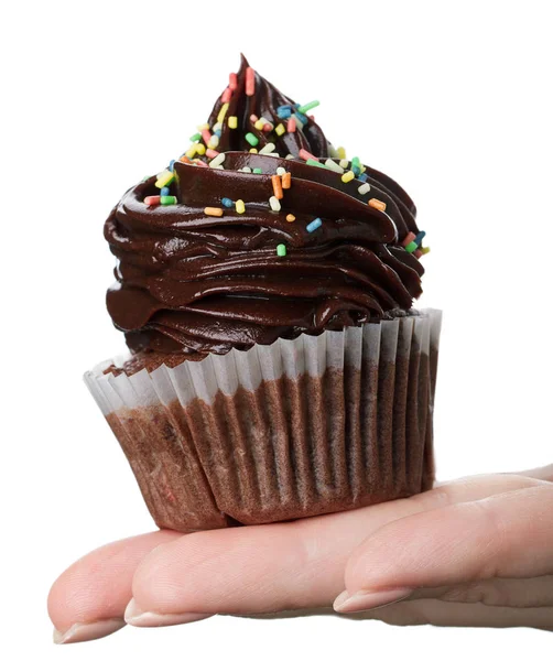 Schöne feminine Hand hält leckeren appetitlichen Schokoladen-Cupcake — Stockfoto