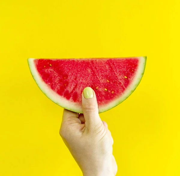 Beautiful feminine hands holding fresh tasty red appetizing — Stock Photo, Image