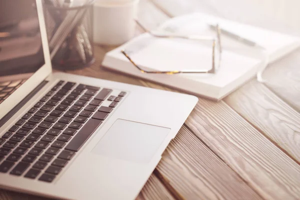 Laptop on working desktop — Stock Photo, Image