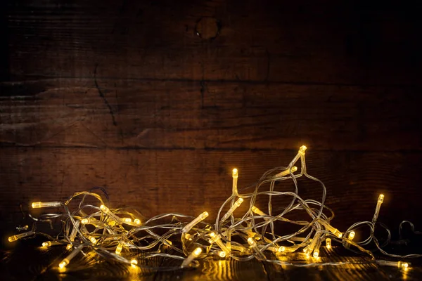 Glowing garland in dark — Stock Photo, Image