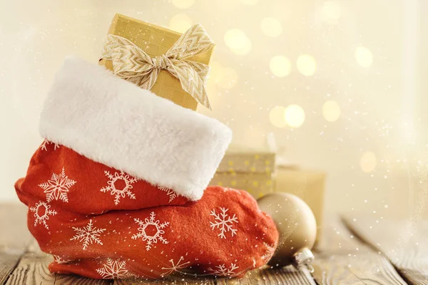 Christmas stocking with presents — Stock Photo, Image