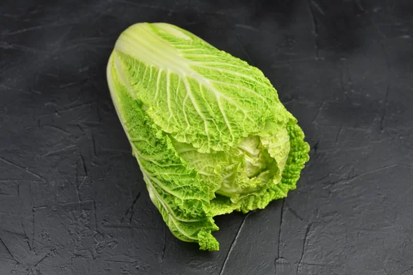 Fresh chinese cabbage head on black background. Vegan food lifestyle. — Stock Photo, Image