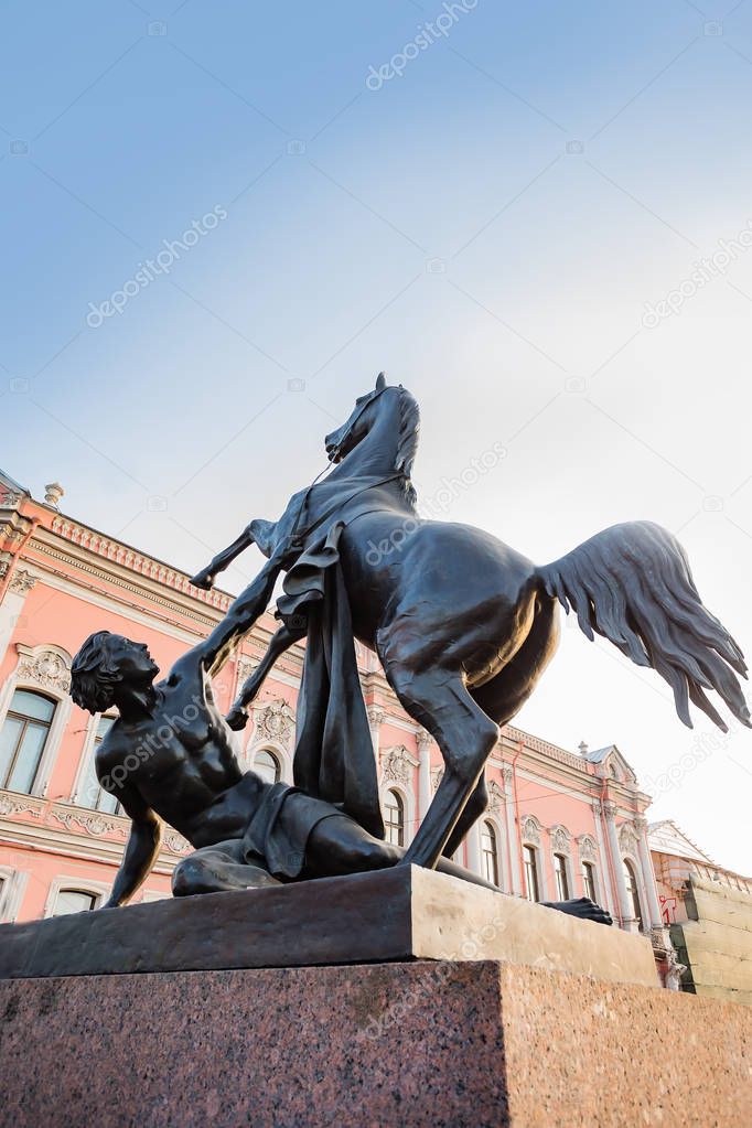 Anichkov Bridge in St. Petersburg with sculptures of horses and a sunny summer morning. Inscription on the bridge: Passage of ships is prohibited.