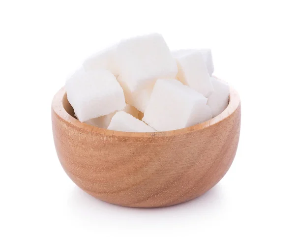 Cubo de azúcar en cuenco de madera sobre fondo blanco — Foto de Stock