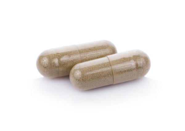 капсулы таблетки изолированы на белом фоне