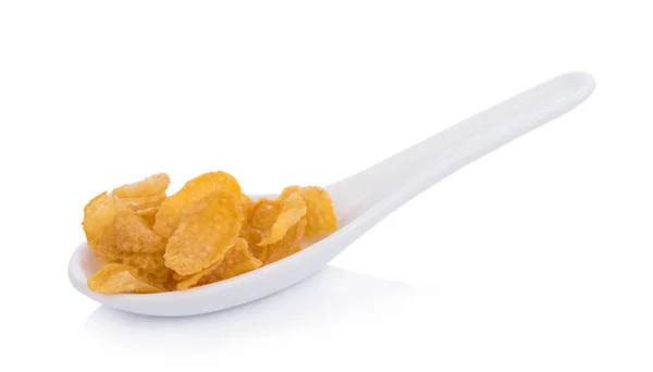 Fiocchi di mais in cucchiaio su sfondo bianco — Foto Stock