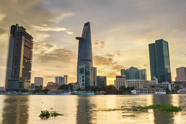 Downtown Saigon in sunset (view from Thu Thiem district) in HDR, Ho Chi Minh city, Vietnam. Ho Chi Minh city (aka Saigon) is the largest city and economic center in Vietnam with population around 10 million people.