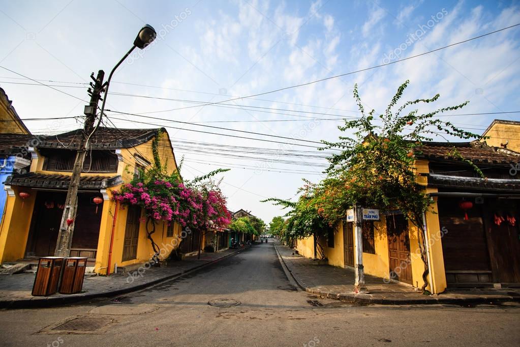 A crossroad in Hoi An on early morning sunshine, Quang Nam, Vietnam. Hoi An is recognized as a World Heritage Site by UNESCO.