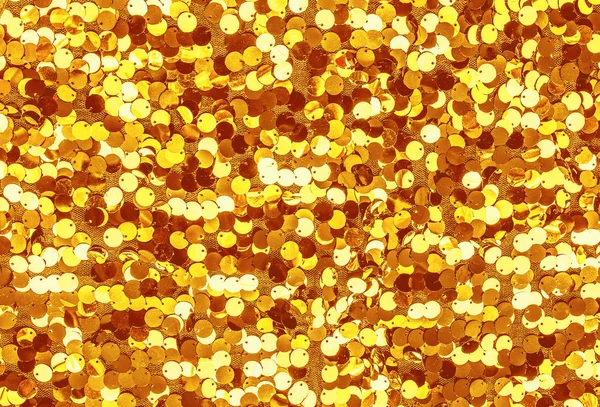 Gouden pailletten. Glinsterende goud. — Stockfoto