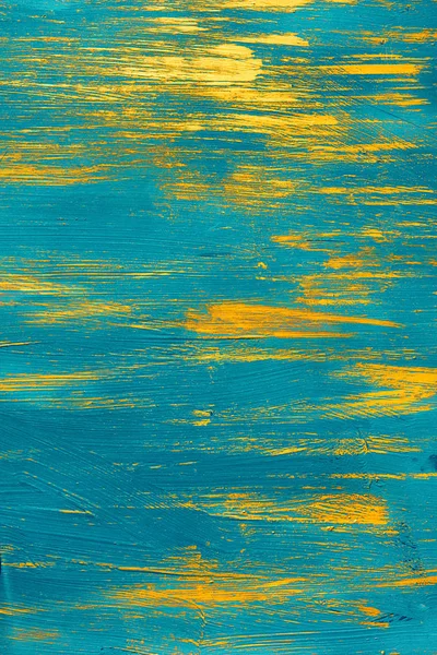 Złotej farby na niebieskim tle — Zdjęcie stockowe