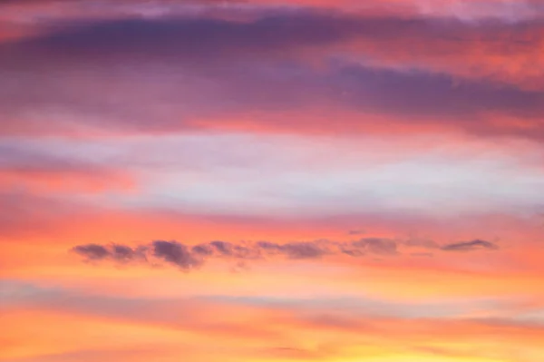 Red and yellow clouds in the sunset sky — 스톡 사진