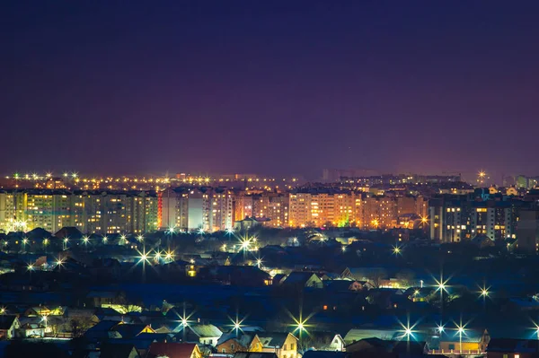 Panorama nocturno de la ciudad en invierno —  Fotos de Stock