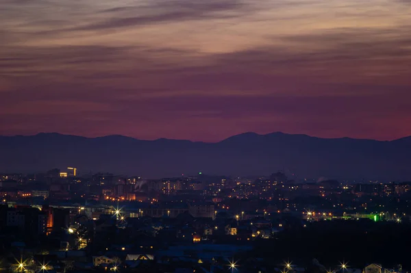 Beautiful sunset sky over the evening city — Stock Photo, Image