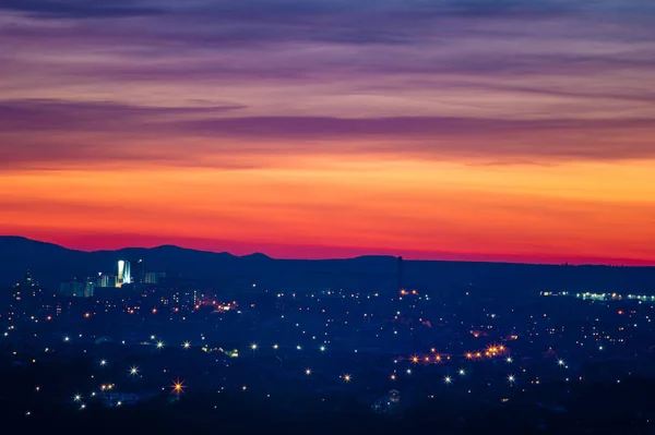 Beautiful sunset sky over the evening city — Stock Photo, Image