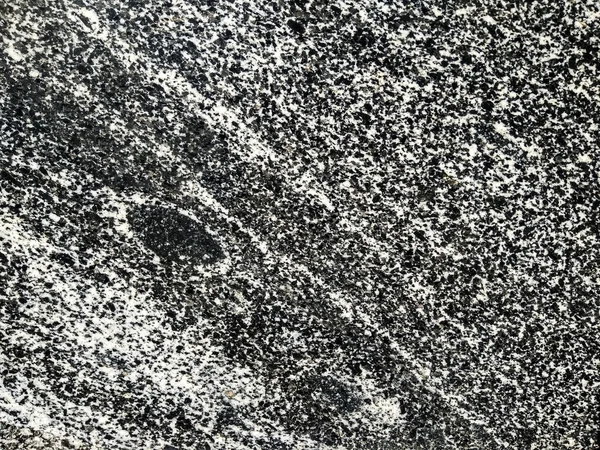 Texture of black and white granite rock. Natural grained stone background