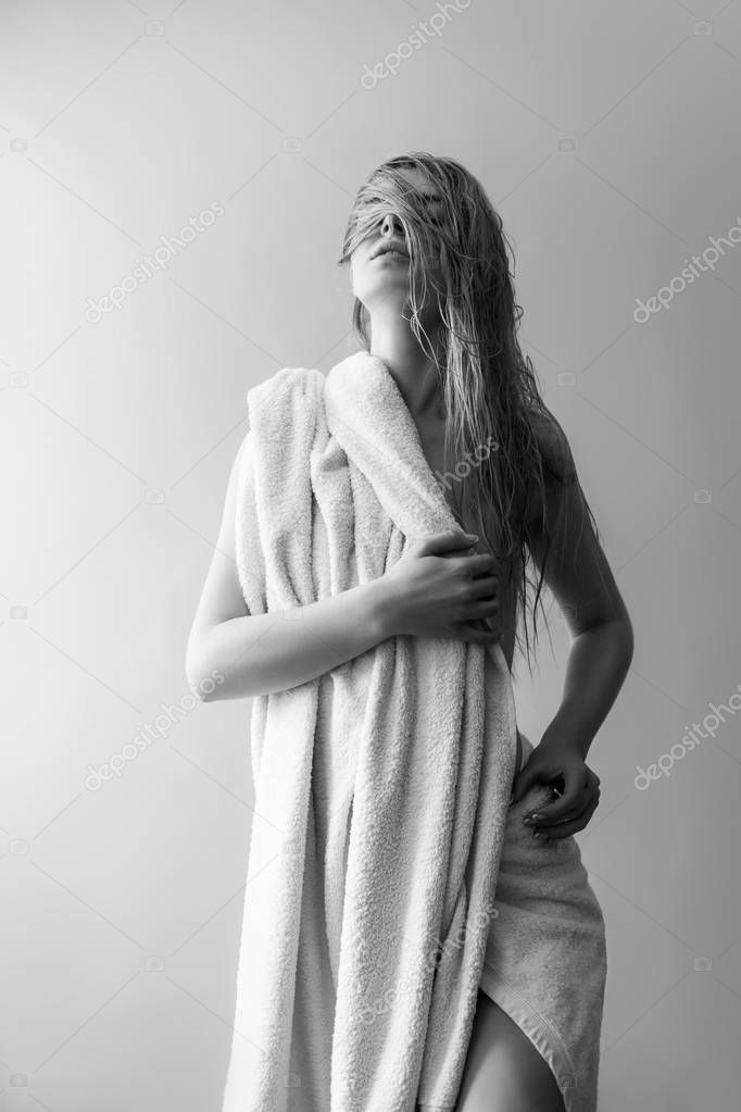 Nude blonde in white towel 