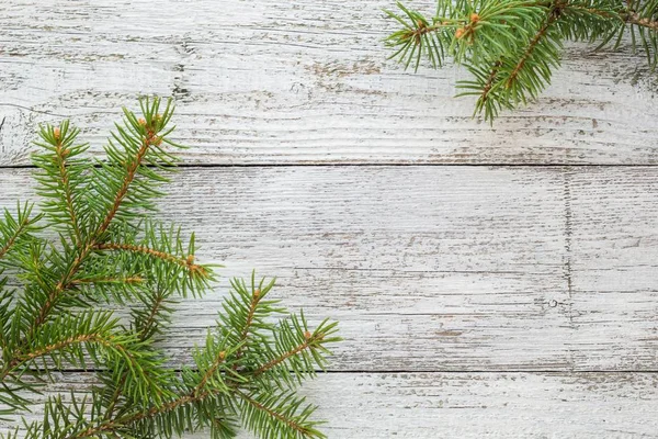 Fondo de madera de Navidad con abeto. Espacio de copia vista superior — Foto de Stock