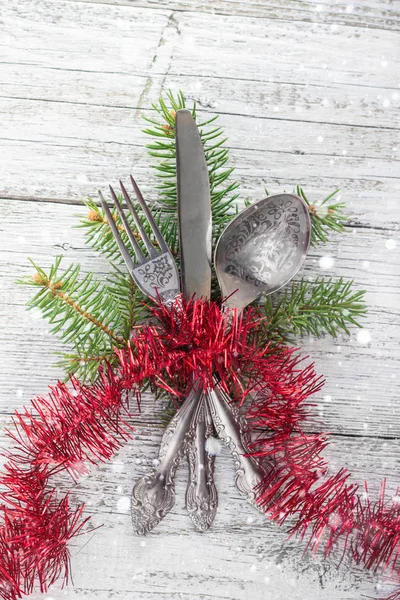 Christmas wooden table with knife, fork and spoon — Stock Photo, Image