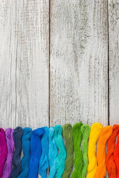 Stock image colorful sewing threads for embroidery on white background