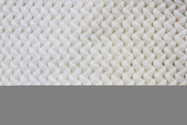 Pulóver, vagy sálat minta a fehér kötött szövet textúra háttér — Stock Fotó