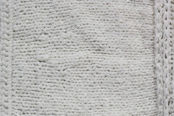 Pulóver, vagy sálat minta a fehér kötött szövet textúra háttér — Stock Fotó