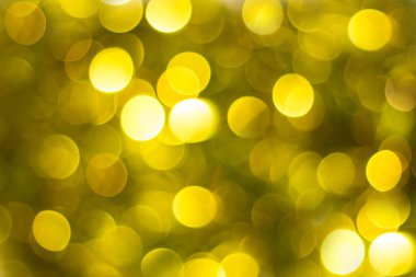 Bokeh odaklı ışıklarla altın soyut arkaplan