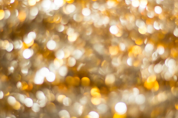 gold abstract background with bokeh defocused lights