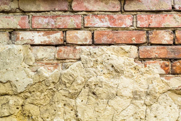 Background of old vintage brick wall with concrete,Weathered texture of racked concrete vintage brick wall background