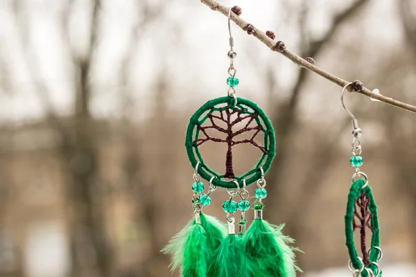 Earrings of Dream catcher with feathers threads and beads rope hanging. Dreamcatcher handmade — Stock Photo, Image
