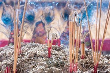 Incense sticks to pay homage to the Chinese New Year blessing in the temple clipart