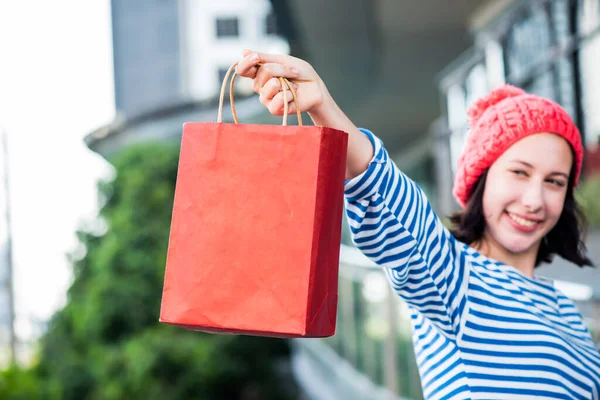 Shopping gift and present on holiday for New Year and Birthday party.Teenager woman holding shopping bags