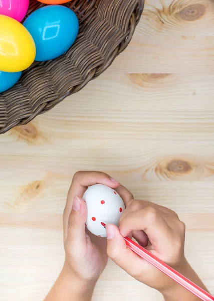 Happy Easter day, little kid coloring easter egg