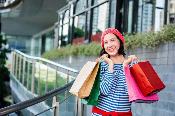 Shopping gift and present on holiday for New Year and Birthday party.Teenager women holding a shopping bag.