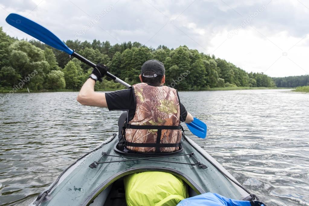 A man rowing a kayak