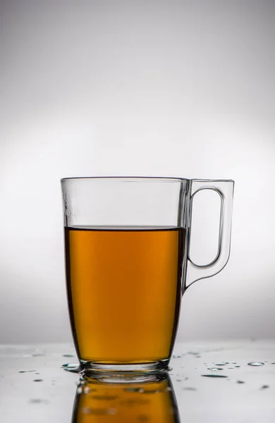 Tea in transparent mug — Stock Photo, Image