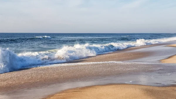 Sea surf on the beach on a sunny day — Stock Photo, Image