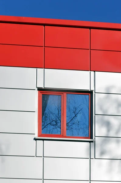 Modern building of red and white panels