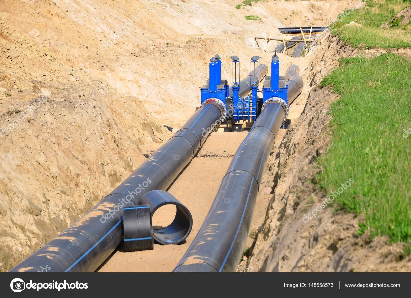 Black plastic pipe in trench of sand — Stock Photo © struvictory 148558573