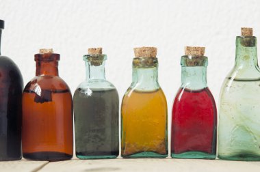 Glass bottles with color liquids clipart