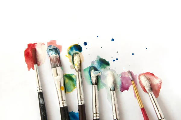 Artistic brushes with color paint — Stock Photo, Image