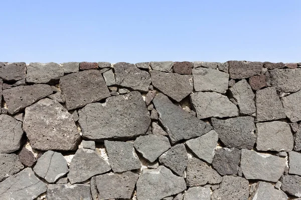 Grens muur in lavasteen — Stockfoto